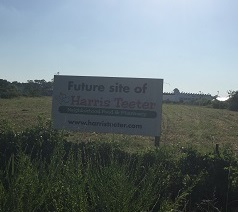 A sign announcing the future Harris Teeter on Carolina Beach has been on the site for the past several years. Photo by Caroline Curran.