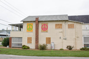 A house with creative boards for hurricane protection. Kure Beach, Thursday, Oct. 6. Photo by Hannah Leyva.