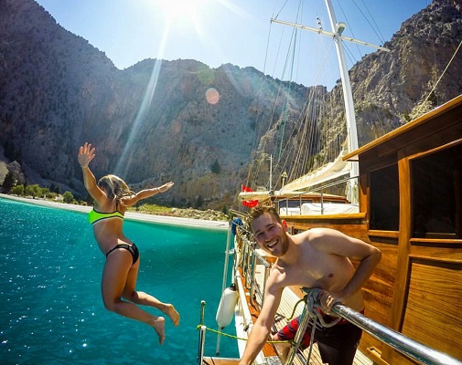 Wilmington resident Cameron Seagle, right, and his girlfriend Natasha Alden, airborne, have been traveling the world for the past four years. (The World Pursuit instagram)