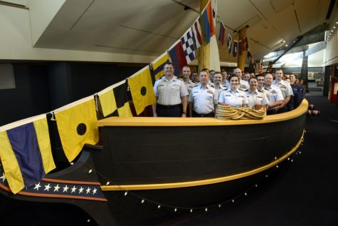 Members of the modern-day Coast Guard cutter Diligence pose aboard a replica of the schooner Diligence at the Independence Seaport Museum in Philadelphia, Saturday, Dec. 10, 2016. The replica is a life-sized model of the 18th century ship, hand-built and constructed within the museum.