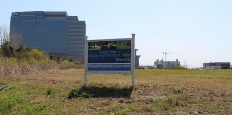 The lot in downtown Wilmington has been empty since the city purchased it in 2013, now a plan for a city park with a performance venue, beer gardens and retail has been approved. In the background, PPD to the left, the marina restaurants in the bottom right. (Photo by Benjamin Schachtman.)