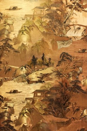 The walls in the kitchen appear to almost shimmer gold from a distance, but on closer inspection, they actually support a very delicate and intricate design, done in the style of Japanese silk art. (Port City Daily photo/CORY MANNION)
