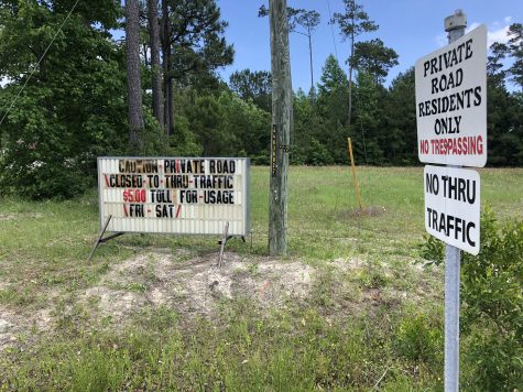 Members of the neighborhood road maintenance organization elected to collect a toll for through traffic traveling to Surf City (Port City Daily photo/Michael Praats)