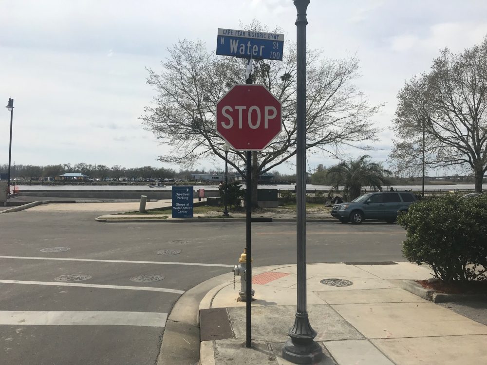 There is a small sign at the base of Princess Street indicating that shops are still open. Business owners on the street, however, fear that the larger 'Road closed to thru traffic' signs still discourage most foot traffic. (Port City Daily photo / Benjamin Schachtman)