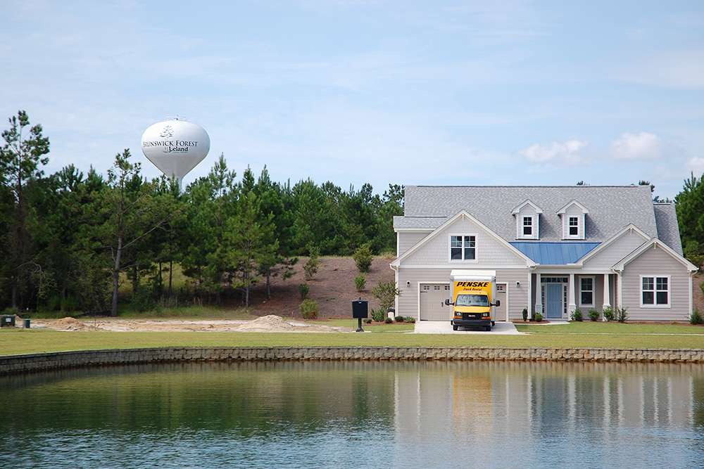 Leland's water tower in Brunswick Forest is not always filled with the amount of water necessary to maintain adequate pressure to the town's water customers. A new booster pump, set to be installed by the end of the year, will address this issue. (Port City Daily photo/File)