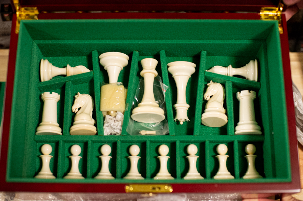 A $27,000 chess set carved from heartwood ebony and 20,000-year-old mammoth ivory by renown ivory sculptor Oleg Raikis. (Port City Daily photo/Mark Darrough)