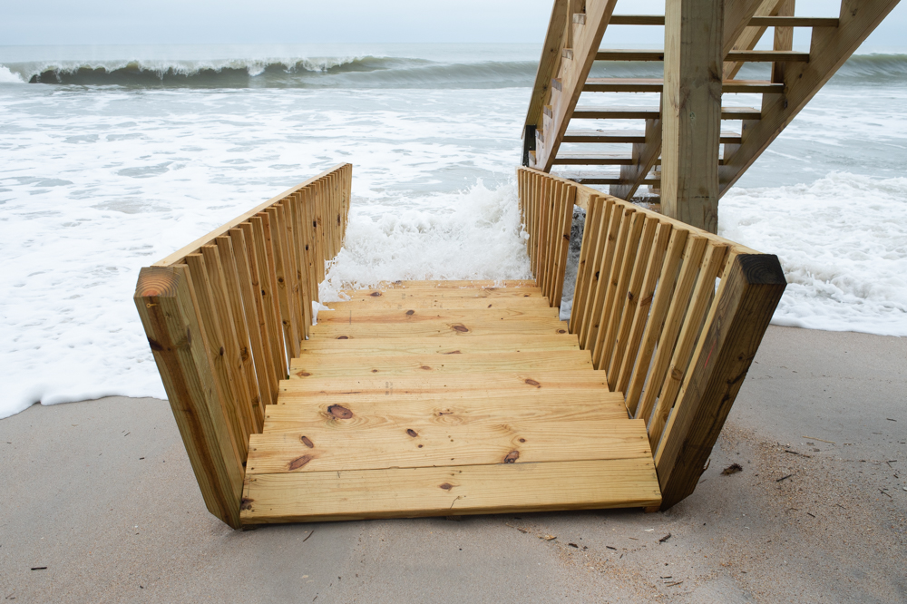 <!-- wp:paragraph --> <p>Just before noon Monday, the storm was still pushing in a severe high tide. Sue Andrews lives in an oceanfront home along the 1400 block of North Shore Drive, where several of the dune breaches occurred.</p> <!-- /wp:paragraph --> <!-- wp:paragraph --> <p>"We lost all of the new sand berm that the town built in March," Andrews said. "Saturday we lost half of it, and by early Sunday afternoon, it was all gone."</p> <!-- /wp:paragraph -->