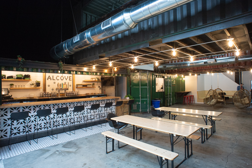 One one end of the old Quonset hut is Billy Batten's Alcove Beer Garden; on the other is his brother Chris Batten's second Bespoke Coffee shop. (Port City Daily photo/Mark Darrough)