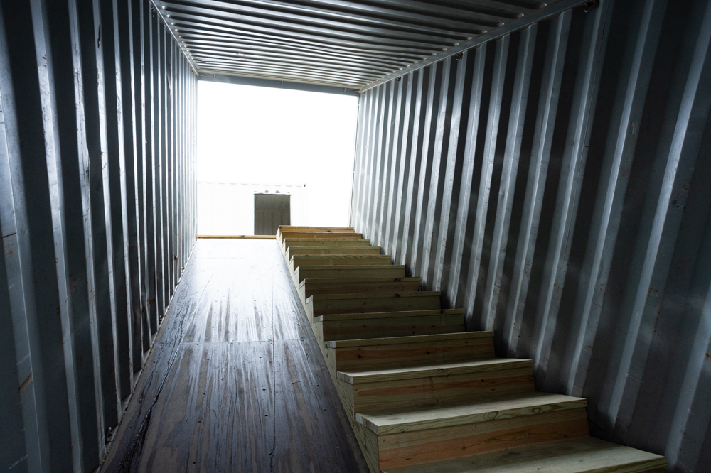 Outside, a staircase will lead up a tilted shipping container to an upstairs patio above a start-up hamburger restaurant. (Port City Daily photo/Mark Darrough)