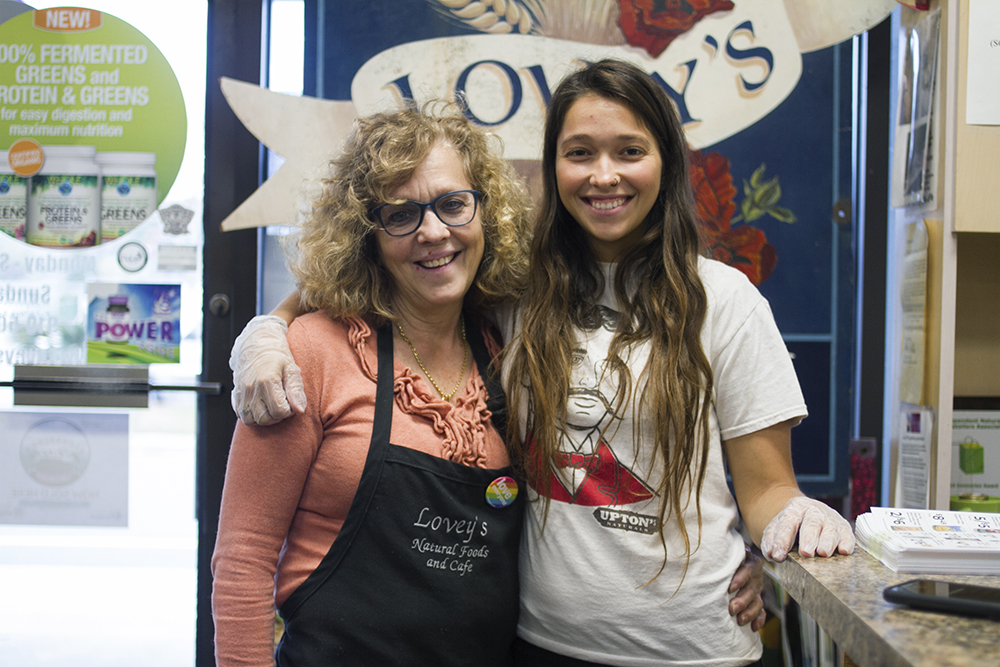Lovey's Natural Foods & Cafe owner Marie Montemurro and her daughter, Gabriella Parga, stay working to provide health supplies, produce, and other goods as the coronavirus shuts down businesses across the nation. (Port City Daily photo/Johanna F. Still)