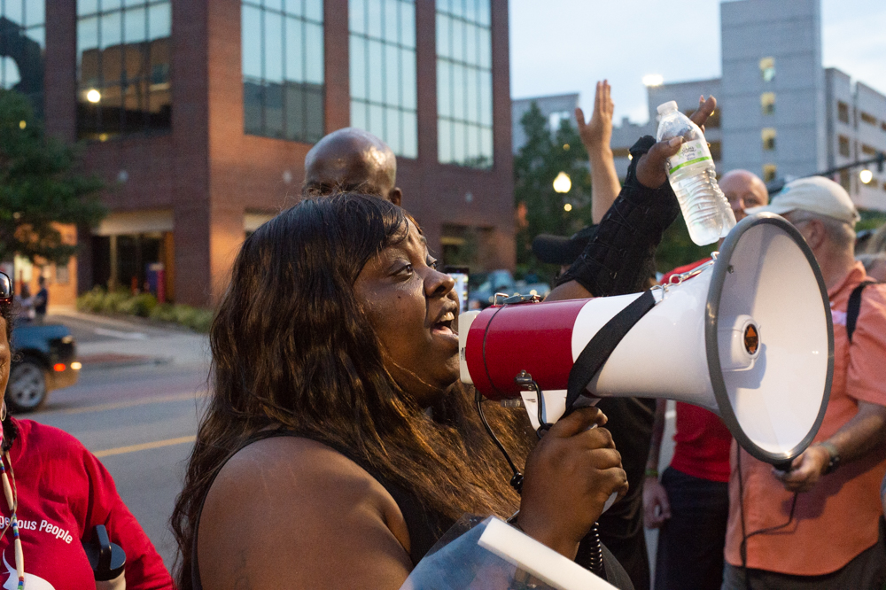 Georgia Davis, sister of Brandon Smith, who was shot and killed by law enforcement officers in 2013, at an early June protest. (Port City Daily photo/Mark Darrough)