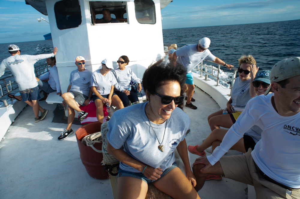Sue Walters, Brian's aunt, sits at the front of the boat as it motors toward the sinking site. (Port City Daily photo/Mark Darrough)