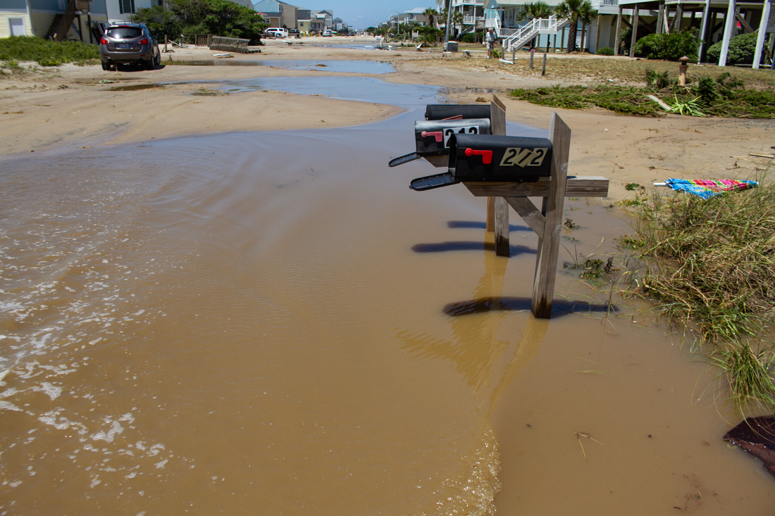 Miles of West Beach Drive was covered in sand after Hurricane Isaias. (Port City Daily photo/Johanna F. Still)